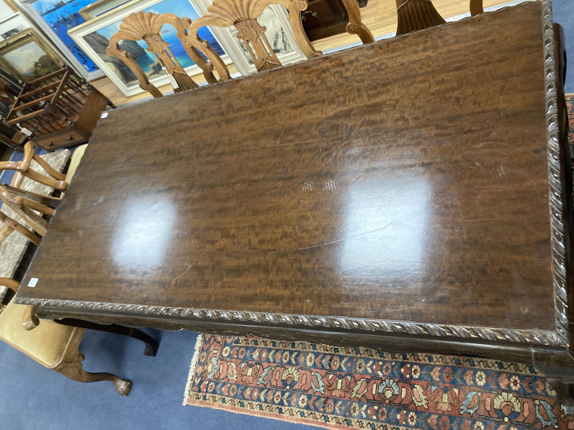 A George III style mahogany rectangular topped dining table, length 188cm, depth 94cm, height 78cm